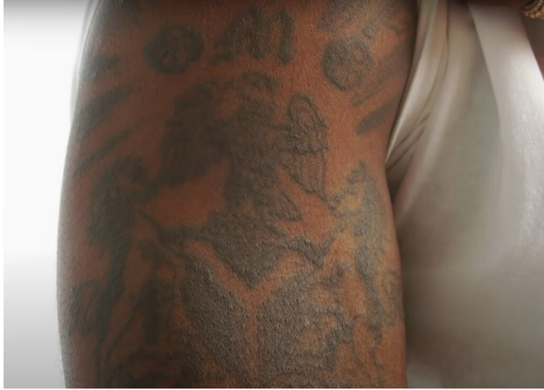 Burnaboy’s Coat of Arms Tattoo 